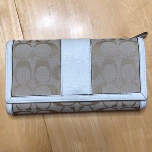Coach trifold wallet with check holder.